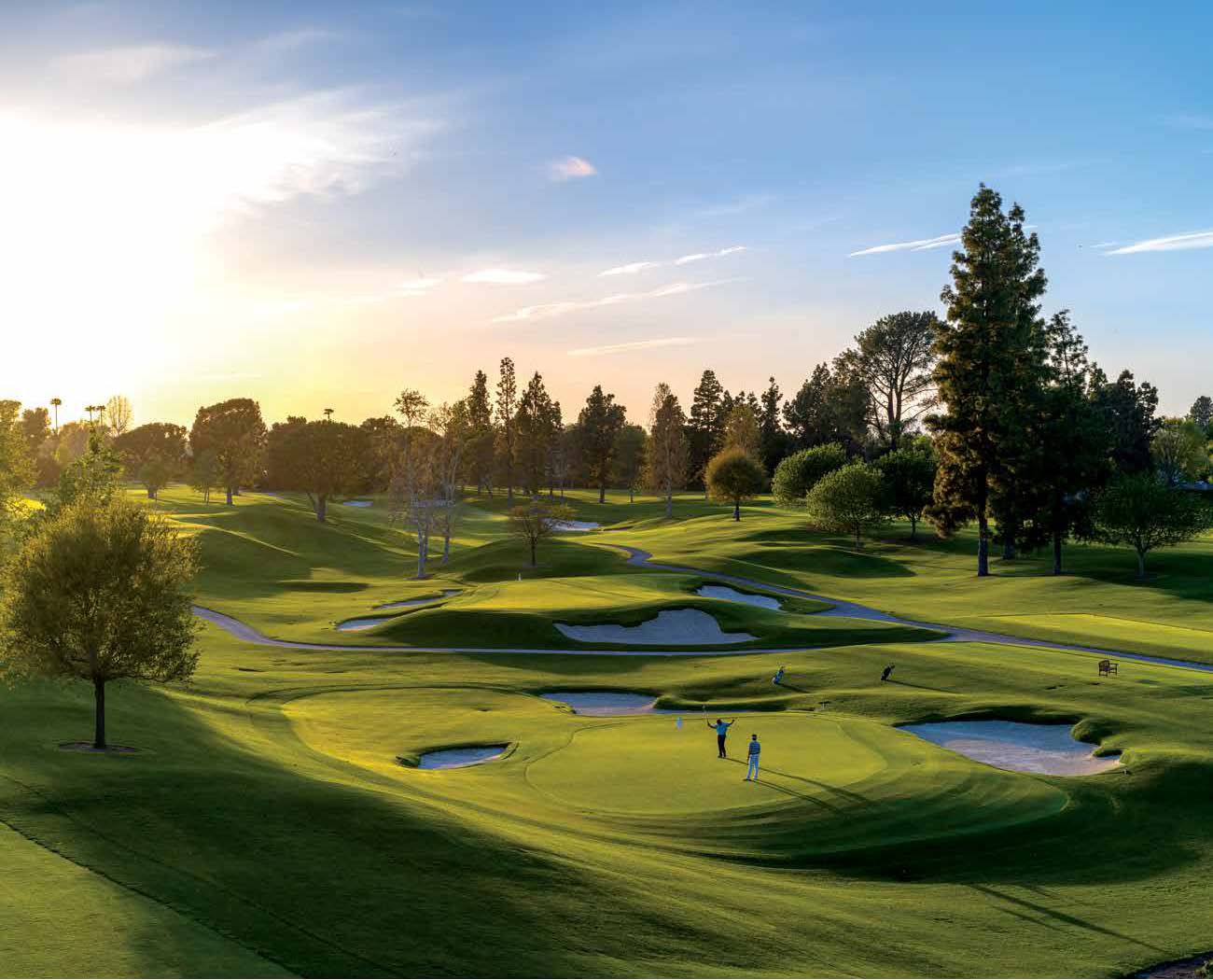 A golf course at sunset